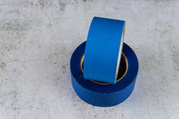 set of blue painter's tape on grey background